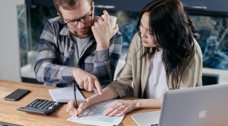 couple calculating all their bills