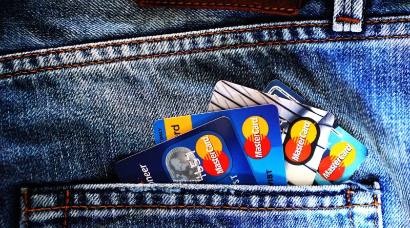 blue master card on denim pocket