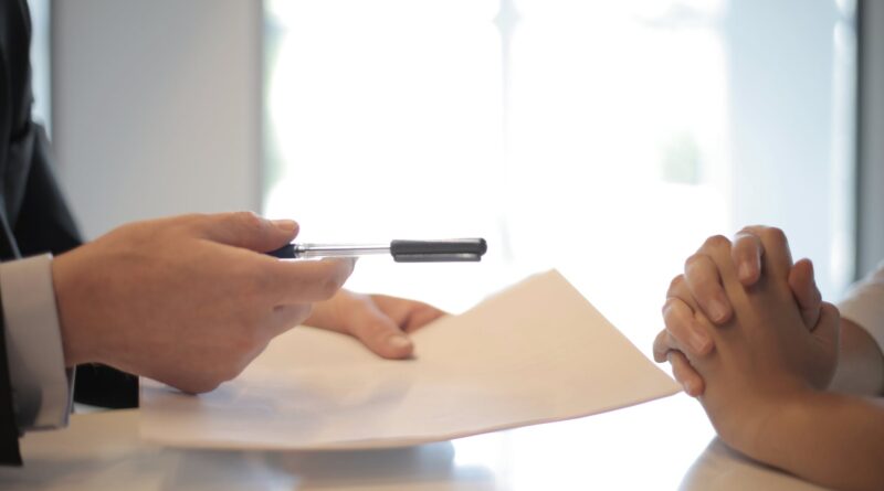 crop businessman giving contract to woman to sign